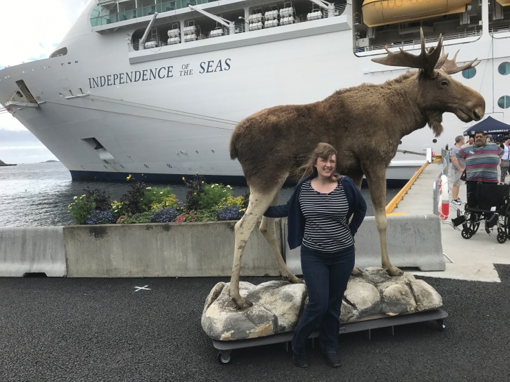 Kristiansand - June 2017 - Joanne with a stuffed moose and Independence of the Seas in the background